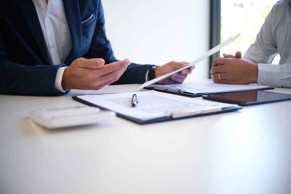 Photo of people at desk